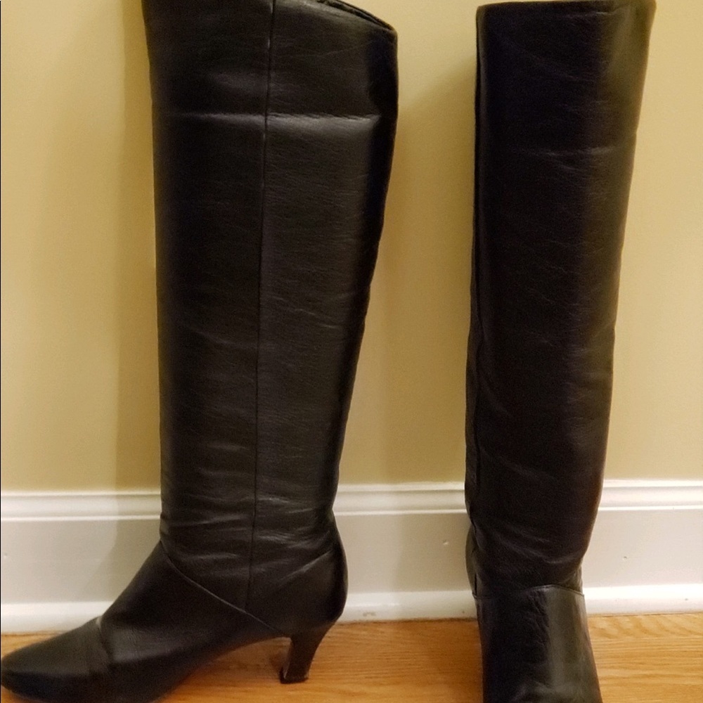 Knee high woman’s black leather boots